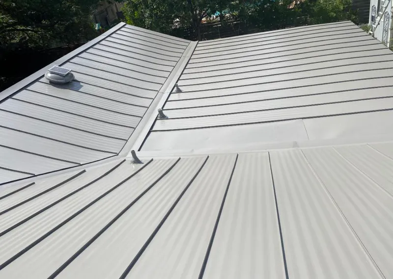 Solar attic fan installed on a metal roof for Roof Ventilation in DeLand